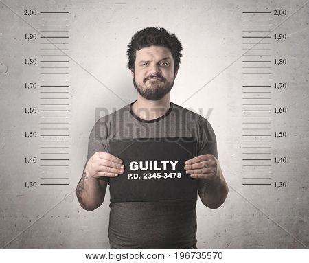 Caught guilty man with ID signs on his hand.