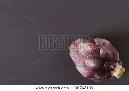 Baby Ripping Organic Artichokes With Lemon. Food For A Vegan And