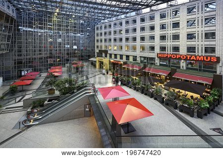 Paris France May 29 2017 : Interior of a beautiful and modern mall with restaurant and terrace office district Italy place in Paris france