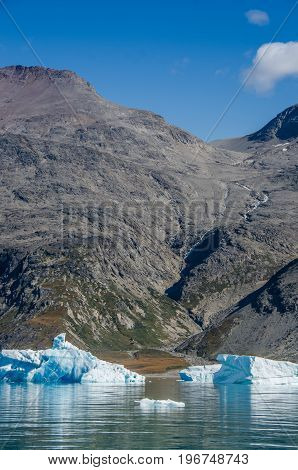 Small and blue iceberg near the coast Greenland