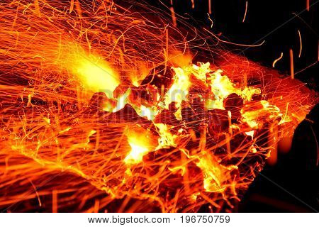 Hot sparking live-coals burning in a barbecue