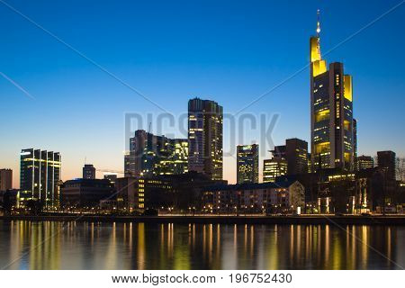 The illuminated skyline of Frankfurt in Germany at night