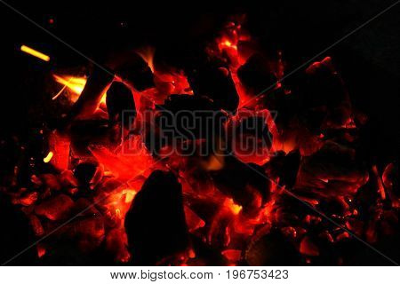 Hot sparking live-coals burning in a barbecue