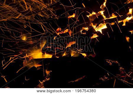 Hot sparking live-coals burning in a barbecue
