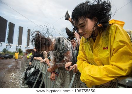 Headbanging Crowd In The First Row At A Hardcore Concert