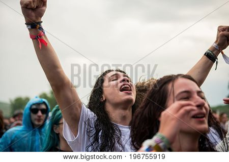 Headbanging Crowd In The First Row At A Hardcore Concert