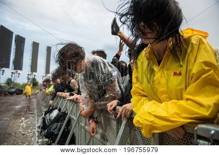 Headbanging Crowd In The First Row At A Hardcore Concert