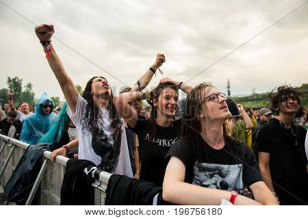 Headbanging Crowd In The First Row At A Hardcore Concert
