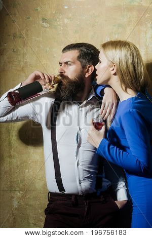 Girl With Glass Of Liqueur Looking At Man Drinking Wine