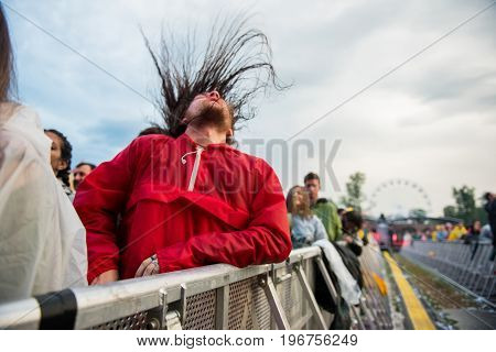 Headbanging Crowd In The First Row At A Hardcore Concert