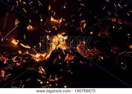 Hot sparking live-coals burning in a barbecue