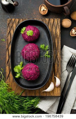 Snack of beet cabbage walnut and cilantro. Traditional Georgian dish Pkhali. Selective focus.Top view. Copy space.