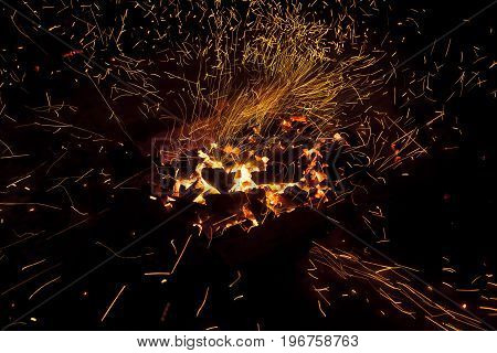 Hot sparking live-coals burning in a barbecue