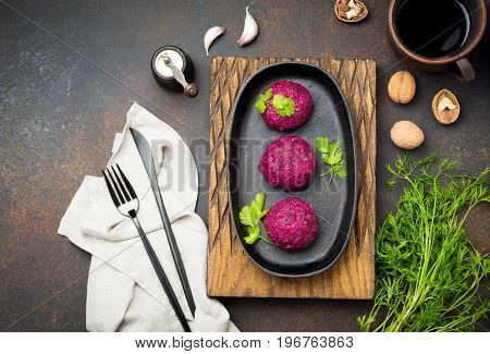 Snack of beet cabbage walnut and cilantro. Traditional Georgian dish Pkhali. Selective focus.Top view. Copy space.