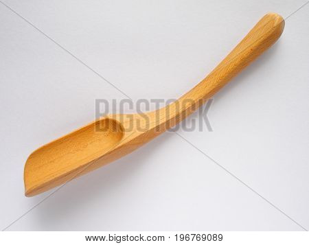 beech wood spoon for making tea on white background
