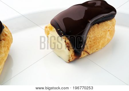 Traditional French Dessert. Eclair With Chocolate Icing. Pastery Concept