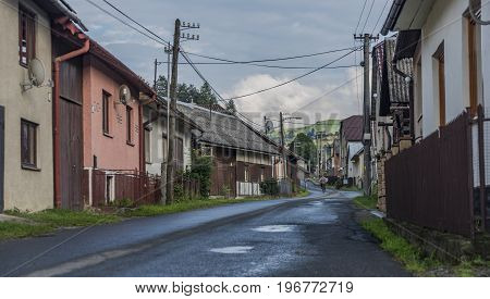 Lesnica village after Mass in church and after rain