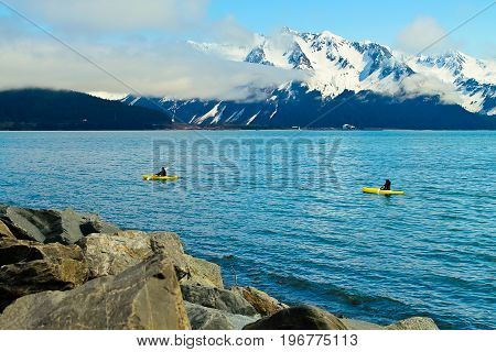 A view of some sea kayakers in Resurrection bay in Seward Alaska