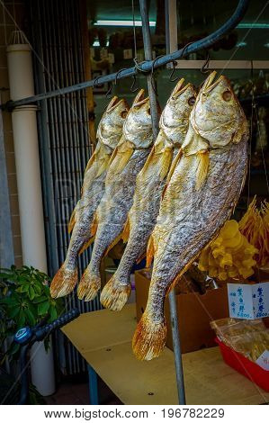 Fresh fish over a newspaper in a market in fishermen town in lantau, Hong Kong, China.