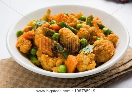 indian spicy food Gobi matar Masala or cauliflower curry with green peas or phool gobi fry, selective focus