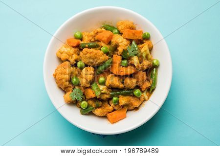 indian spicy food Gobi matar Masala or cauliflower curry with green peas or phool gobi fry, selective focus