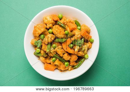 indian spicy food Gobi matar Masala or cauliflower curry with green peas or phool gobi fry, selective focus