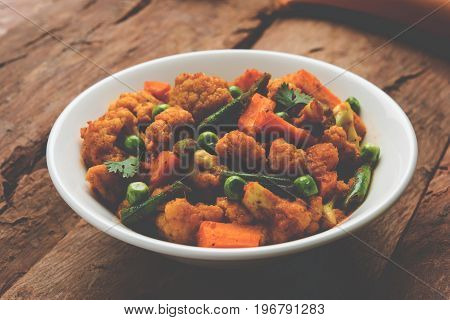 indian spicy food Gobi matar Masala or cauliflower curry with green peas or phool gobi fry, selective focus