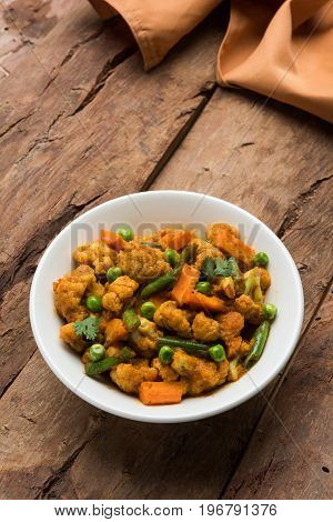 indian spicy food Gobi matar Masala or cauliflower curry with green peas or phool gobi fry, selective focus