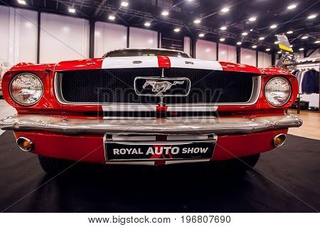 SAINT-PETERSBURG, RUSSIA - JULE 23, 2017: Front view of Classic Ford Mustang GT 390 on Royal Auto Show. Close up of Car hood and radiator with headlamp