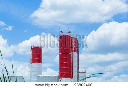 Business of cement factory,Cement mixer with clouds and sky