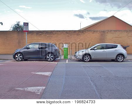 Dublin, Ireland - June 3, 2017: Electric Vehicle 'EV' charging electric power in battery at public charge point. Ecars operates and maintains 1,200 public charge points across the island of Ireland.