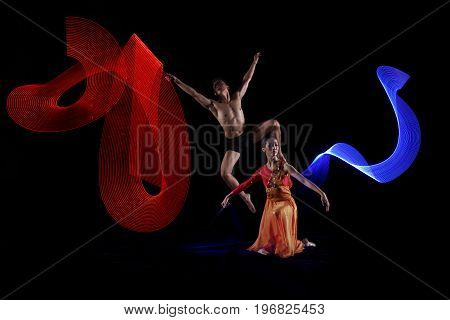Portrait Of Couple Ballet Dancing With Motion Lights Effect