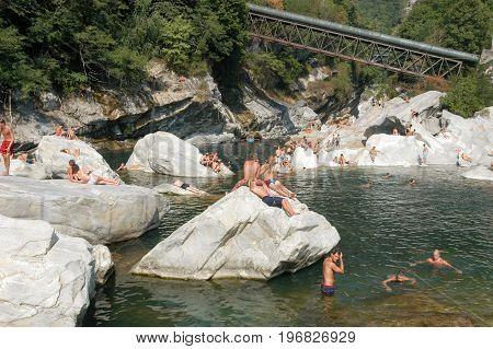 People Swimming And Sunbathing On Maggia River At Ponte Brolla