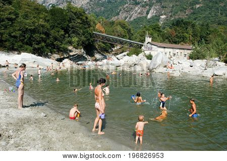 People Swimming And Sunbathing On Maggia River At Ponte Brolla