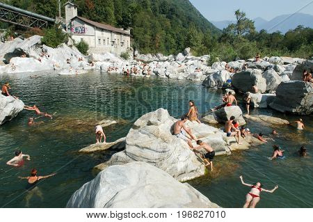 People Swimming And Sunbathing On Maggia River At Ponte Brolla