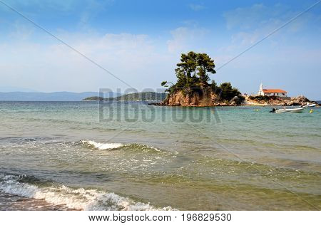 Small island with church Agios Nikolaos near Ellinika beach, Euboea- Greece