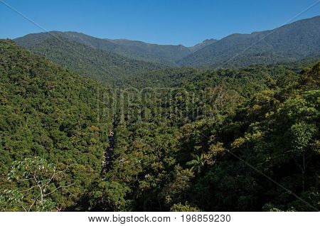 Overview of hills and peaks covered by forests in the Itatiaia Park, an altitude park, known for its animal diversity, trails and waterfalls. Located in the Rio de Janeiro State, southwestern Brazil