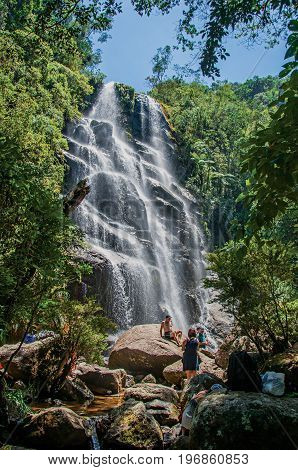 Itatiaia, Brazil - January 20, 2015. View of waterfall and people in the Itatiaia Park, an altitude park, known for its wildlife, trails and forests. Rio de Janeiro State, southwestern Brazil