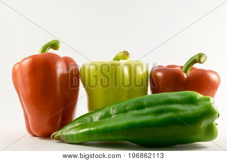 colored fresh peppers. Isolated on white background