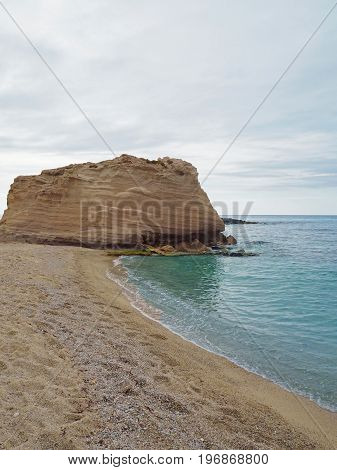 Sandstone Cliff On The Beautiful Sand Beach With Turquoise Sea Water