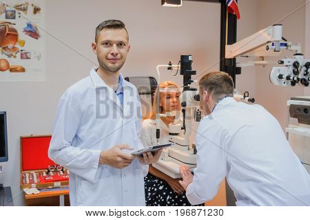 Portret Of Young Beautiful Doctor/eye Specialist/optometrist In An Ophthalmologic Clinic