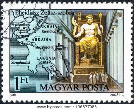 UKRAINE - CIRCA 2017: A postage stamp printed in Hungary shows Statue of Zeus in Olympia by Pheidias from series Seven Wonders of the Ancient World circa 1980