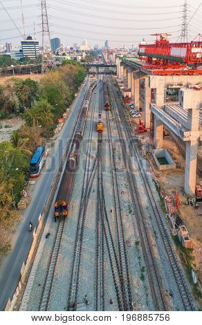 Freight and passenger train waiting at the train station parking lot.Cargo transit.import export and business logistic.Aerial view.Top view. Railway construction