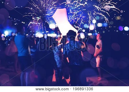 People Celebrate New Year. Fireworks circle blur. Colorful in celebration. Thailand Beach