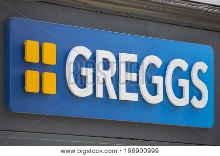 YORK UK - JULY 18TH 2017: The Greggs company logo above a shopfront to one of their stores in York UK on 18th July 2017.