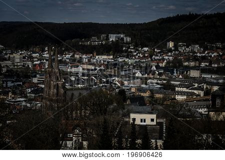 MARBURG GERMANY - APRIL 18 2015: The new and the old part of the city from the surrounding hills. Toning. Stylization. Marburg is a university town in the German federal state (Bundesland) of Hessen.
