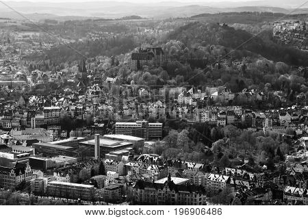 MARBURG GERMANY - APRIL 18 2015: The new and the old part of the city from the surrounding hills. Black and white. Marburg is a university town in the German federal state (Bundesland) of Hessen.