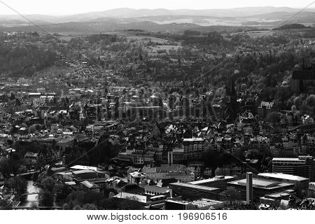 MARBURG GERMANY - APRIL 18 2015: The new and the old part of the city from the surrounding hills. Black and white. Marburg is a university town in the German federal state (Bundesland) of Hessen.