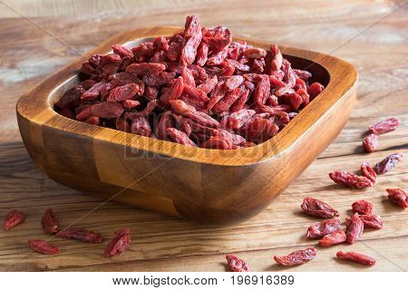 Dried Goji Berries In A Wooden Bowl
