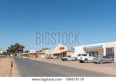 REHOBOTH NAMIBIA - JUNE 14 2017: A street scene with shops and cars in Rehoboth a town in the Hardap Region of Namibia